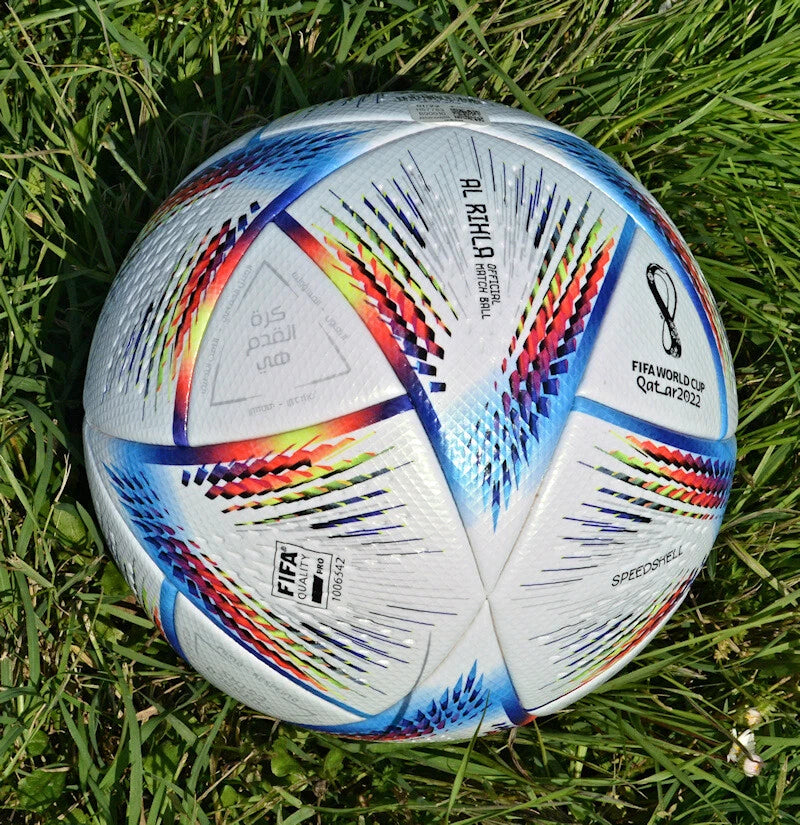 Adidas Al Rihla Pro – vista su ghiaia con logo Speedshell